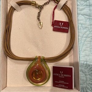 Murano glass pendant on multi cords.